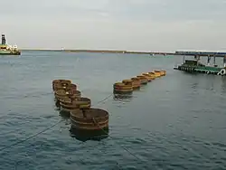Tub shaped boats in the sea.