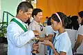 Students receiving Holy Communion during Holy Eucharist