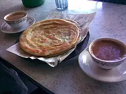 Paratha served with tea.