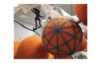 The silhouette of a teenager surfs above the Cavalcade and Ball Arches