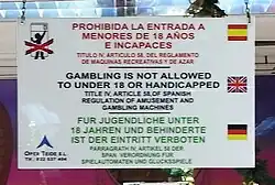 Sign in Tenerife, Spain uses for the Spanish text, for the English text and for the German text.