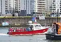 Boat in Belfast Harbour flying a banner of the arms
