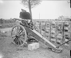 A captured German 5.7 cm Maxim-Nordenfelt gun with destroyed shield. Meaulte-Albert Road after the Battle of the Somme.