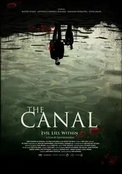A film poster showing the reflection of man and a young boy in the water. At the bottom of the poster, the tag line says, "Evil lies within".