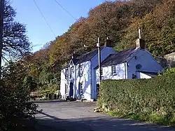 The Dyffryn Arms, Pontfaen located below a wooded escarpment