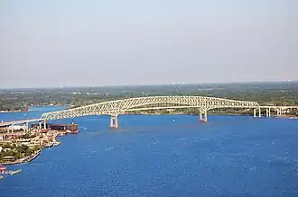 The Hart Bridge spanning the St. Johns River in Jacksonville, Florida, is a continuous, cantilevered truss bridge which combines a suspended road deck on the 332-metre (1,088 ft) main span and through truss decks on the adjacent approach spans