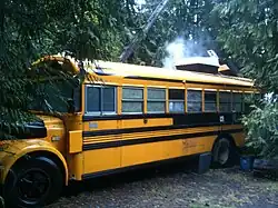A yellow school bus being used as a residence