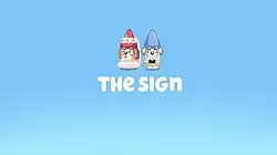 A screenshot for the title card for the Bluey episode, "The Sign", featuring two garden gnomes donned in wedding attire in front of a blue background.