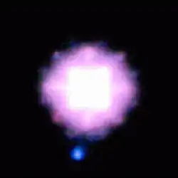 Three-colour image of SCR1845−6357AB generated from the SDI filter images (blue=1.575 μm, green=1.600 μm, red=1.625 μm). Because the T-dwarf fades away towards the longer wavelengths, it appears quite blue in this image. It is roughly 50 times fainter than the star and is separated from it by an angle of 1.17″ on the sky (4.5 times the Earth-Sun distance).