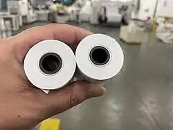 the picture show the thermal paper rolls with red alert line to remind the merchant need replace the news rolls