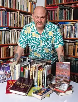 Disch with his books in 1988