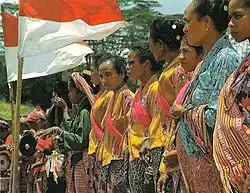 Image 25Timorese women with the Indonesian national flag (from History of Indonesia)