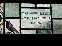 Dedication on the St John the Baptist/St Stephen window executed by Geoffrey and Daphne Robinson.