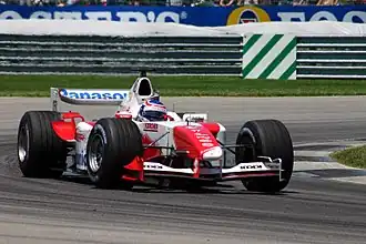 Olivier Panis driving the Toyota TF104 at the 2004 United States Grand Prix.