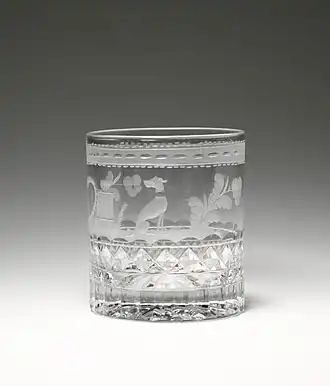 cut glass with engraving of a dog and plants