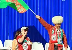 Turkmen football fan with a papakha (right)