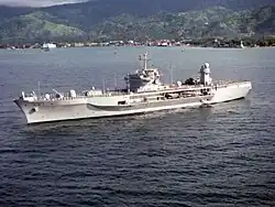 USS Blue Ridge in the Bay of Dili in 2000, with Dili in the background