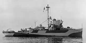 A monochrome ship, with striking paintwork in block patterns