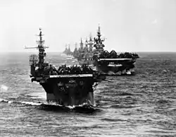 USS Langley (CVL-27) and other ships entering Ulithi 2 December 1944 after strikes in the Philippines.
