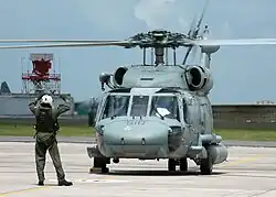 A Helicopter of Anti-Submarine Squadron (HS) 11 prepares to take off.