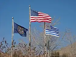 United States flag (center) pre-2011 Utah state flag (left) and the Mormon pioneers flag (right)