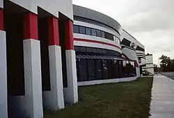 Exterior of a three-story building showing windows and columns