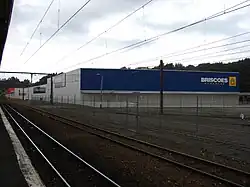Neighbouring big-format retailers at Upper Hutt railway station, from foreground to background: Briscoes, Wellington Beds, Big Save Furniture, Mitre 10 Mega