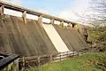 Upper_Tamar_Lake_Dam_Overflowing_-_panoramio