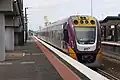 V/Line VLocity train departing Platform 3 towards Southern Cross Station at Sunshine Station in October 2023.