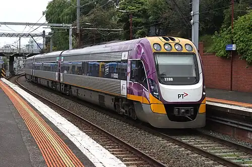 A VLocity train running through South Yarra station.