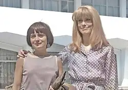 Colourised photograph of Agnès Varda with Catherine Deneuve