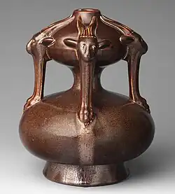 Stoneware Dresser vase with goat masks, 1904, one of his original designs for Ault (in other colours at V&A)