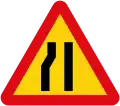 Road narrows on left side