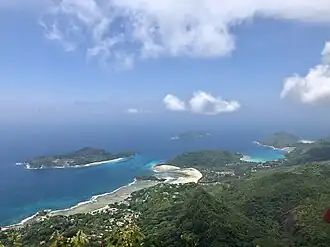 The view from Morne Blanc facing west. Port Glaud is in the foreground. The islands Therese and Conception are in the distance. The bay to the right is Port Launay Marine National Park.