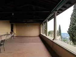 The original entrance leads into the loggia above the villino