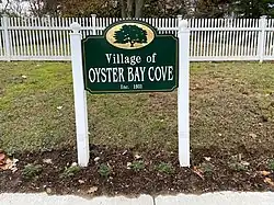 An Oyster Bay Cove village welcome sign