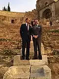 US Ambassador to Spain James Costos (left) with Mayor of Cartagena José López Martínez (politician) [es] (right) at the Roman Theatre during a visit to the Murcia region in November 2015