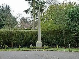 Stone obelisk at end of road
