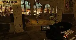 A man with carrying a video game walks behind two soldiers carrying guns into a large, desolate cathedral.