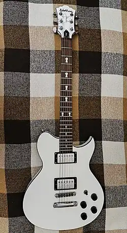 Washburn Idol guitar, white body and headstock, rosewood fretboard