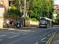 A southbound tram descends the steep gradient