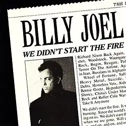 The cover of Billy Joel in a black-and-white photograph posted in a newspaper with its name, The New York Times largely cut out, situated beside the last lines of the lyrics and underneath the header, showing the enlarged name of the artist, and the song title as its sub-header.