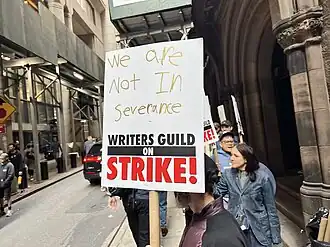 Picket line formed by writers on strike in New York City on location of Daredevil: Born Again. The picket sign in the center references the television series Severance, the production of which was shut down due to the strike. The sign reads, "We are not in Severance."
