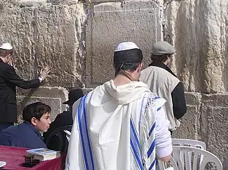 Blue stripes on a traditional Jewish tallit. The blue stripes are also featured in the flag of Israel.