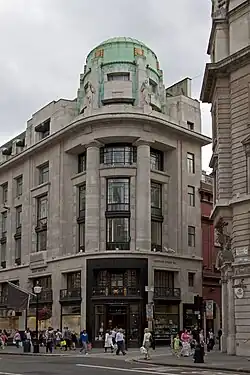 Art Deco reinterpretation of the Doric columns, with no flutings and with little or no entasis, on the Westmorland House (Regent Street no. 117–131), London, by Burnet & Tait, 1920-1925[31]