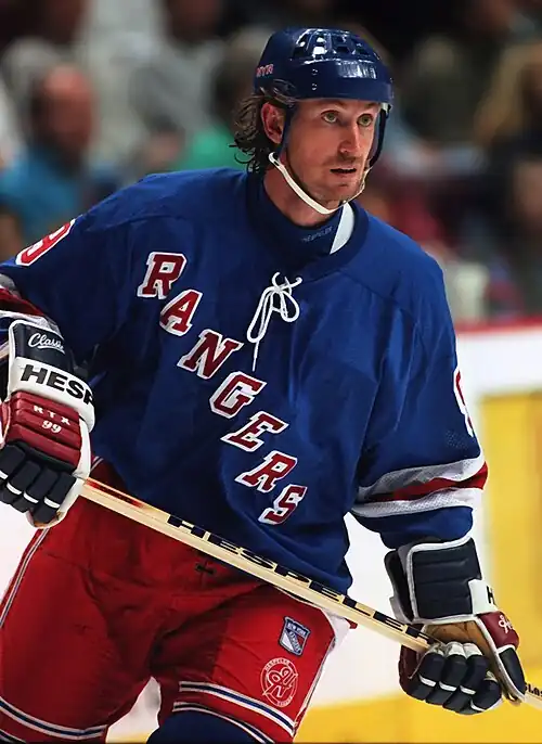 Image 3 Wayne Gretzky Photo credit: Håkan Dahlström Ice hockey player Wayne Gretzky, as a member of the New York Rangers of the National Hockey League (NHL) in 1997. Gretzky, nicknamed "The Great One", is widely considered the best hockey player of all time. Upon his retirement in 1999, he held forty regular-season records, fifteen playoff records, and six All-Star records. He is the only NHL player to total over 200 points in one season—a feat he accomplished four times. In addition, he tallied over 100 points in 15 NHL seasons, 13 of them consecutively. He is the only player to have his number (99) officially retired by the NHL for all teams. More selected pictures