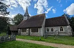 The C19 church of St. Peter and Holy Cross, at Wherwell, Hampshire, England. September 2024.