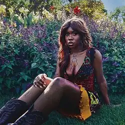 Jackson seated in a field