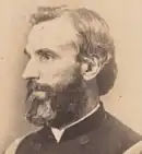 old side-view photo of a Union civil war officer with a beard starting to turn gray