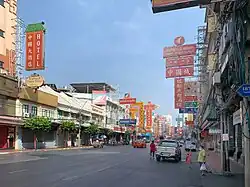a Chinatown street with almost no car and people